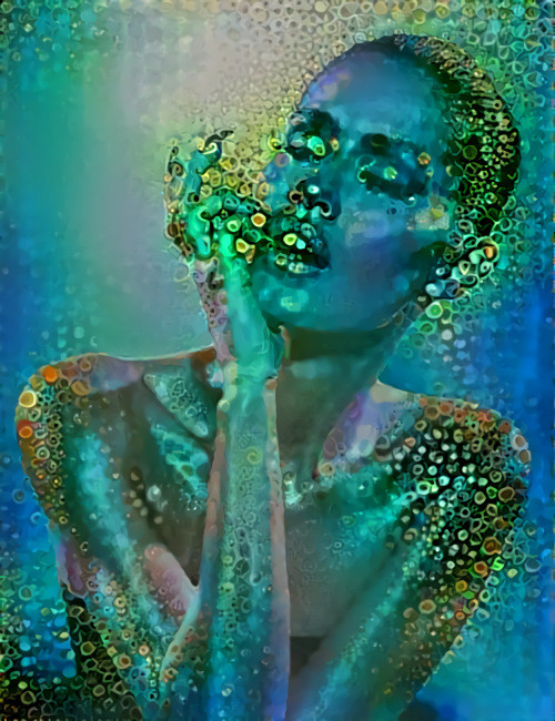 model touching lip, glittering aqua blue green