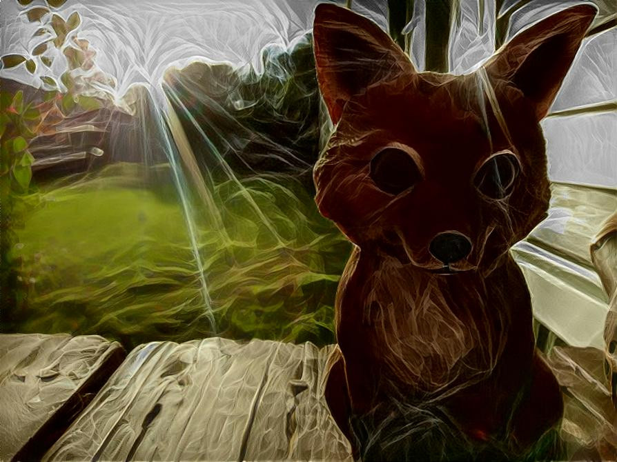Photo I took of a lil fox statue on my parents' porch.