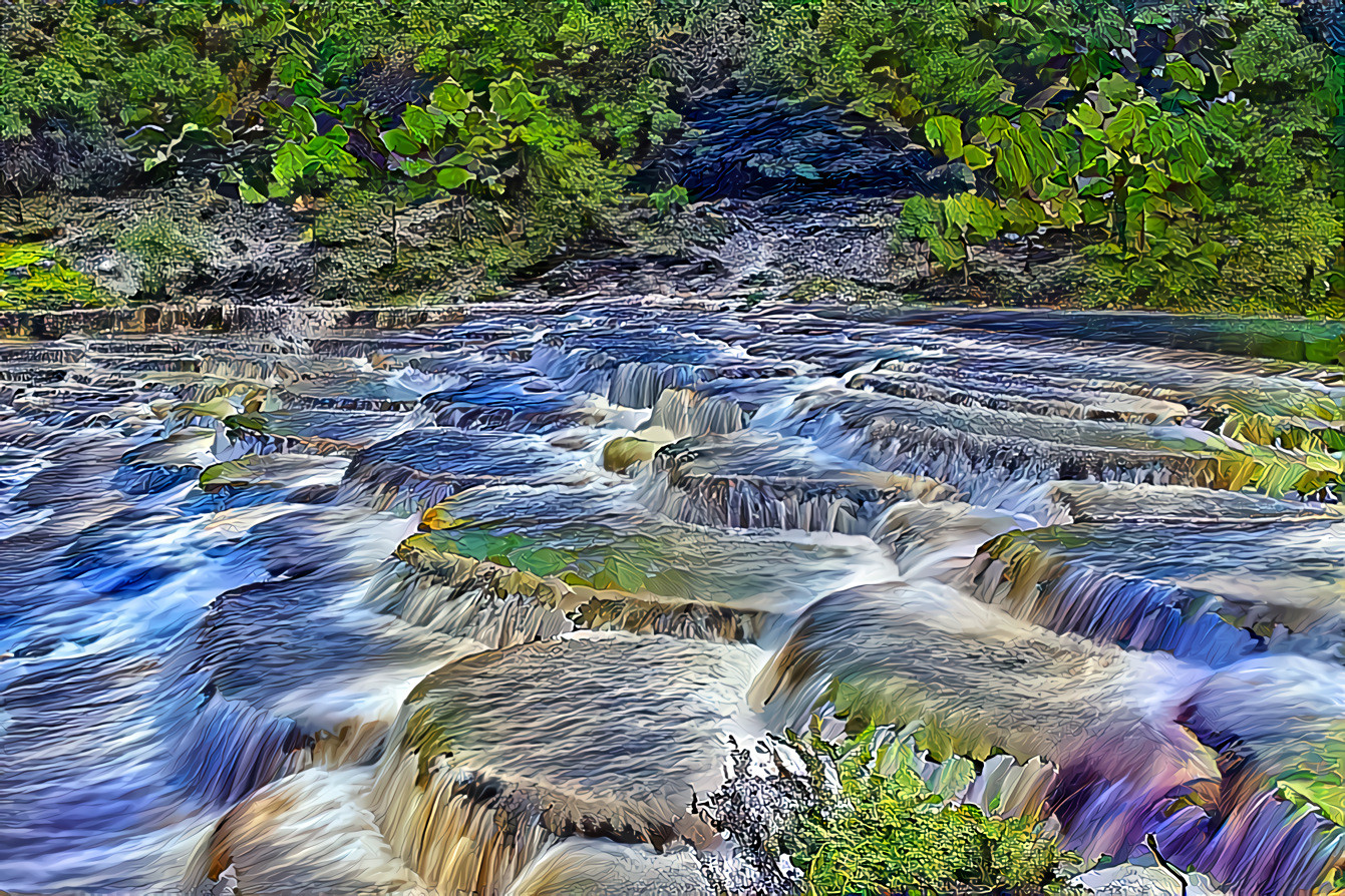 Flowing river over flat rock pads 1