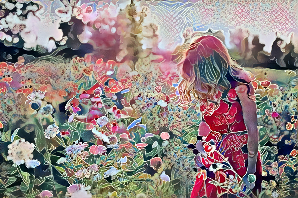 Dreamy girl in a flower field